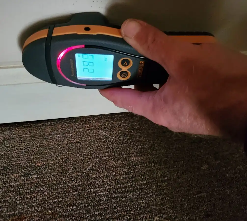 Moisture detection at baseboard during Storm Damage Restoration in Sarasota Springs